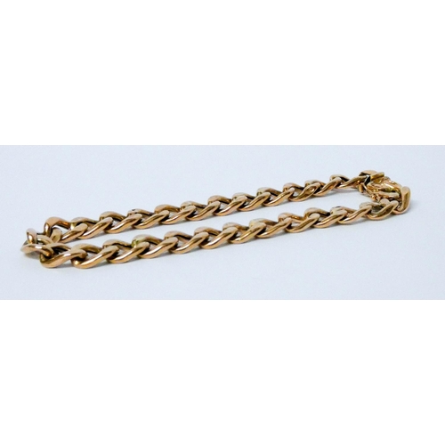 690 - A 9ct gold curb bracelet. 12.8 grams