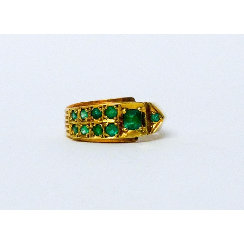 707 - Columbian emerald buckle design ring, in 18ct yellow gold, marked 18k, ring size S, weight 6.8 grams... 