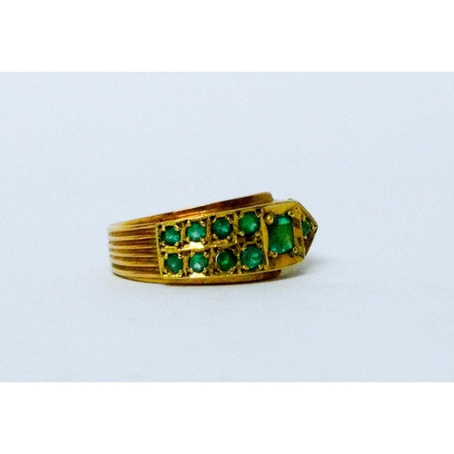 707 - Columbian emerald buckle design ring, in 18ct yellow gold, marked 18k, ring size S, weight 6.8 grams... 