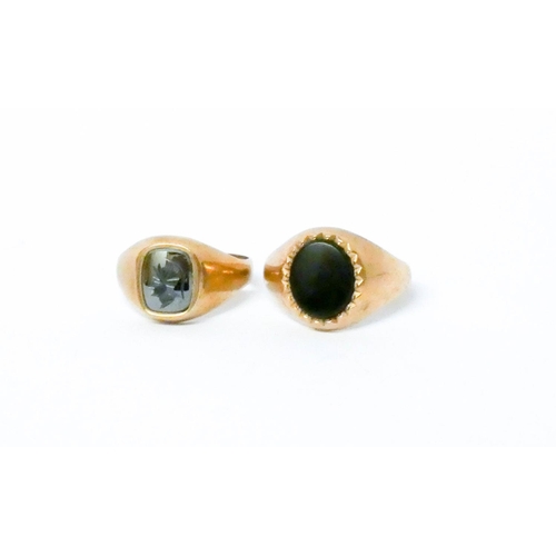 710 - Two gents 9ct gold signet rings, both set with onyx panels. Gross weight 8.9 g