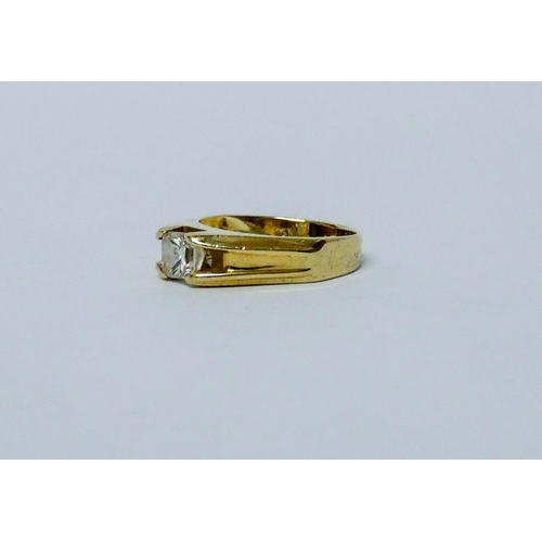 715 - A single stone diamond ring, set with a princess cut diamond in a claw setting, on 14k yellow gold b... 