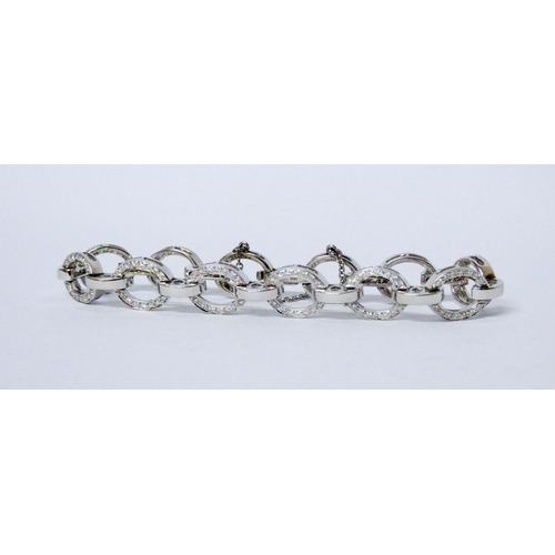 716 - A modern diamond open link bracelet, the oval 18ct white gold links channel set with diamonds, invis... 