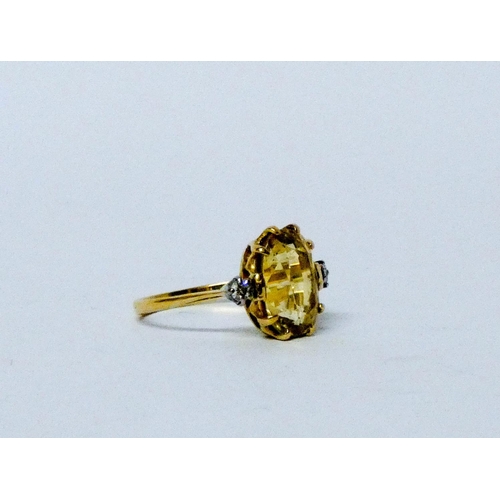 742 - An Art Deco yellow sapphire and diamond ring, large oval mixed cut yellow sapphire with two brillian... 