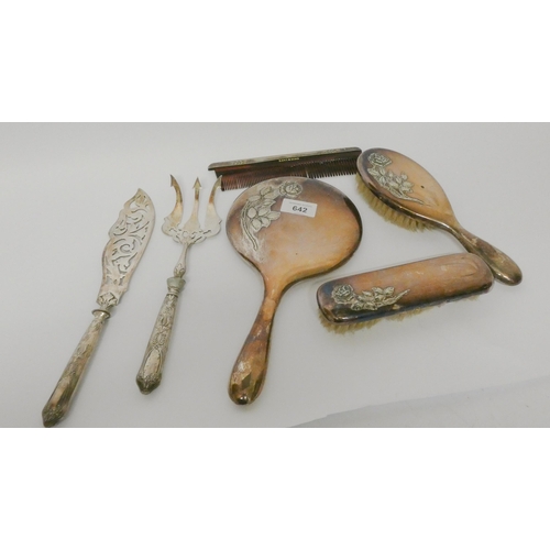 642 - A silver plated dressing table set, hand mirror, comb and brushes, with a pair of silver plated fish...