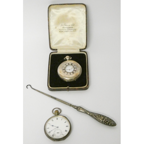 712 - Victorian silver half hunter pocket watch, another silver open face pocket watch and a silver handle... 