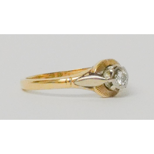 744 - An 18ct gold diamond ring, within a circular setting, hallmarked, ring size O