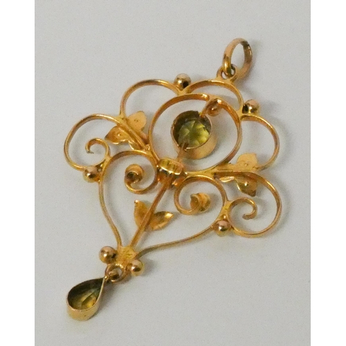 757 - Edwardian 9ct gold peridot and seed pearl Art Nouveau pendant. Marked 9ct. 4.8 cms overall length