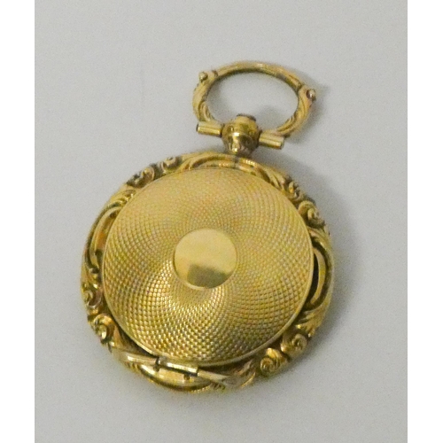 761 - A late Victorian circular gold locket, with hinged lid opening to reveal glazed locket compartment, ... 