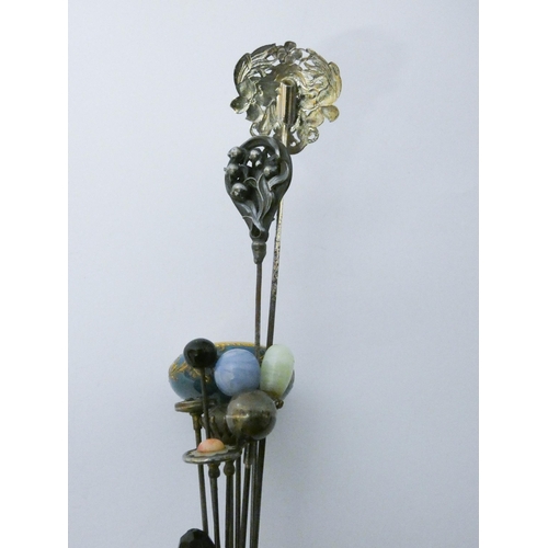 645 - A collection of vintage hat pins to include silver examples....