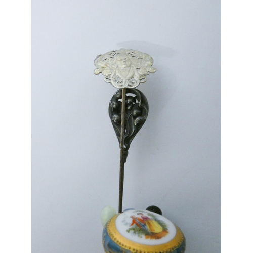 645 - A collection of vintage hat pins to include silver examples....