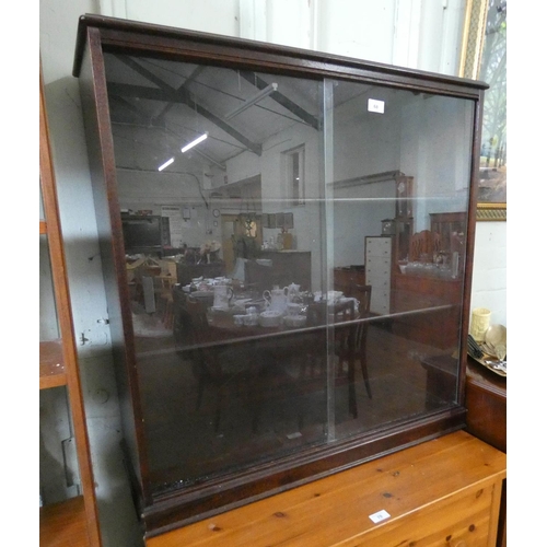 68 - A mahogany framed bookcase with sliding glass doors