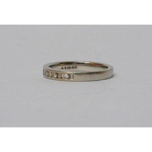 771 - A platinum and diamond half hoop eternity ring, with alternate brilliant and baguette cut diamonds. ... 