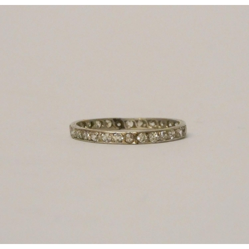 772 - A fully diamond set platinum eternity ring,  size L