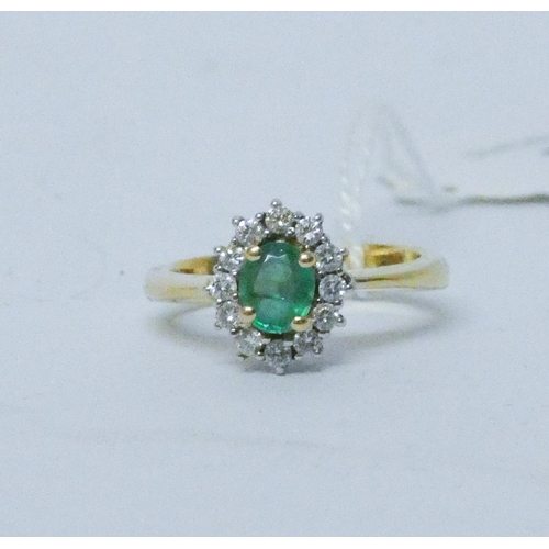 781 - An emerald and diamond oval cluster ring, on 18ct yellow gold band, hallmarked, ring size O