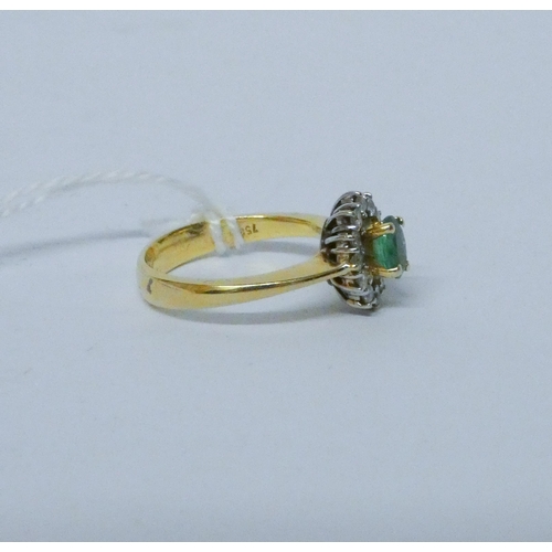 781 - An emerald and diamond oval cluster ring, on 18ct yellow gold band, hallmarked, ring size O