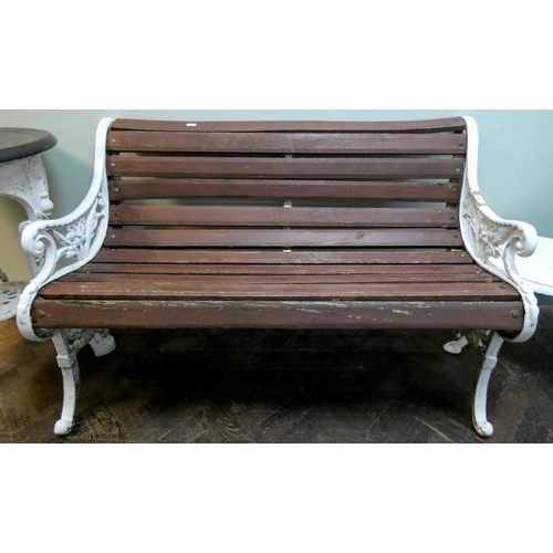 942 - A Victorian style white painted iron framed garden seat...