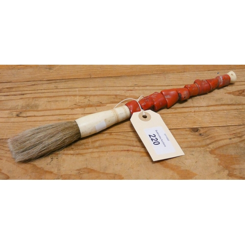 244 - A coral handled Chinese paintbrush