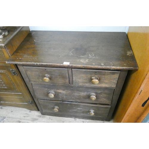 29 - Victorian style stained pine chest of two long and two short drawers with bun handles, 2'9 wide