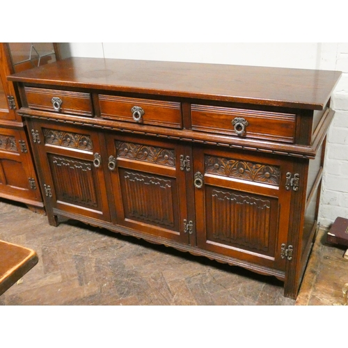 343 - An Old Charm oak sideboard fitted three drawers and linen fold panel cupboards, 4'6 wide matching th... 