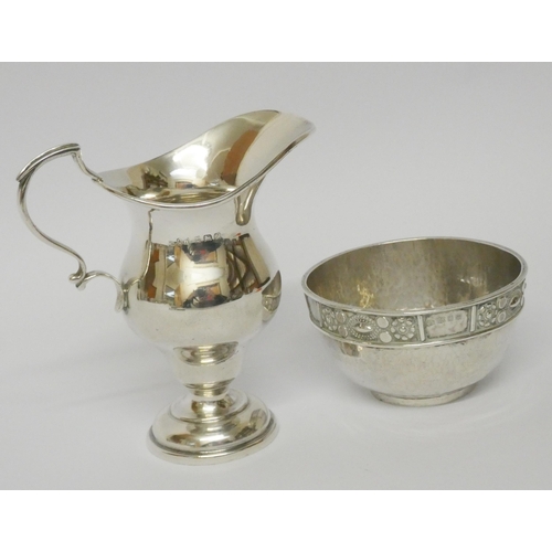 501 - An Arts & Crafts silver sugar basin by Amy Sandheim London 1927 and a silver cream jug Birmingham 19... 