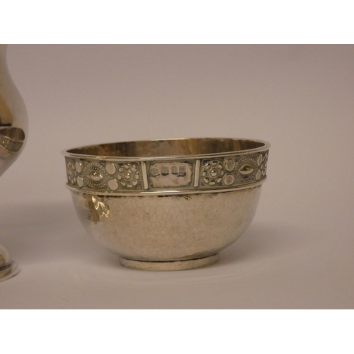 501 - An Arts & Crafts silver sugar basin by Amy Sandheim London 1927 and a silver cream jug Birmingham 19... 