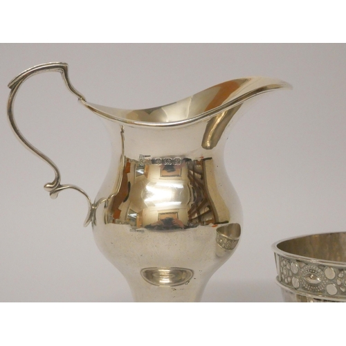 501 - An Arts & Crafts silver sugar basin by Amy Sandheim London 1927 and a silver cream jug Birmingham 19... 