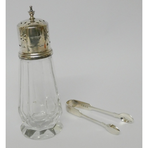 507 - A pair of Victorian silver sugar nips and a silver topped cut glass sugar shaker.