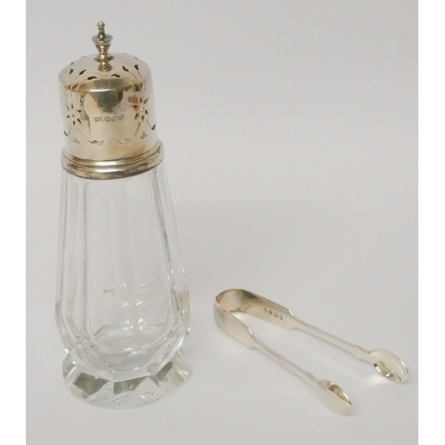 507 - A pair of Victorian silver sugar nips and a silver topped cut glass sugar shaker.