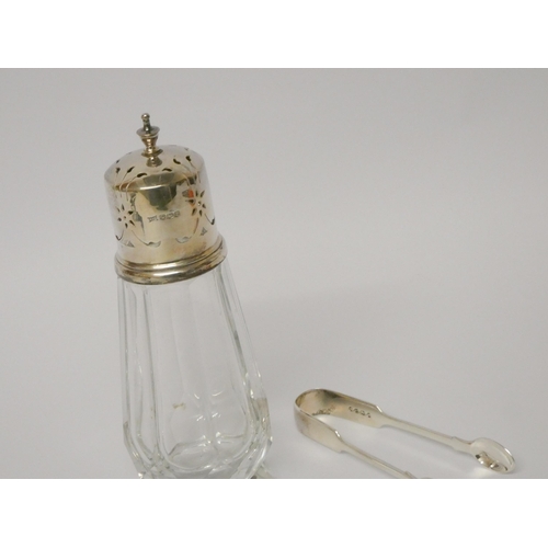 507 - A pair of Victorian silver sugar nips and a silver topped cut glass sugar shaker.