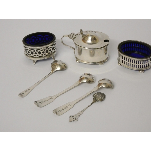 509 - Silver condiments - salt cellars with blue glass liners, Georgian and later salt spoons, mustard wit... 