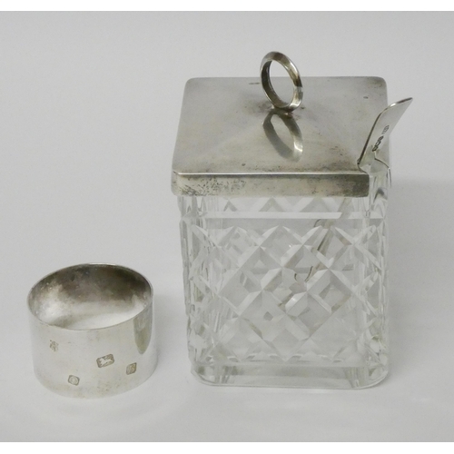 510 - A silver topped cut glass preserve jar with spoon and a silver napkin ring. Weighable silver 3.5 tro... 