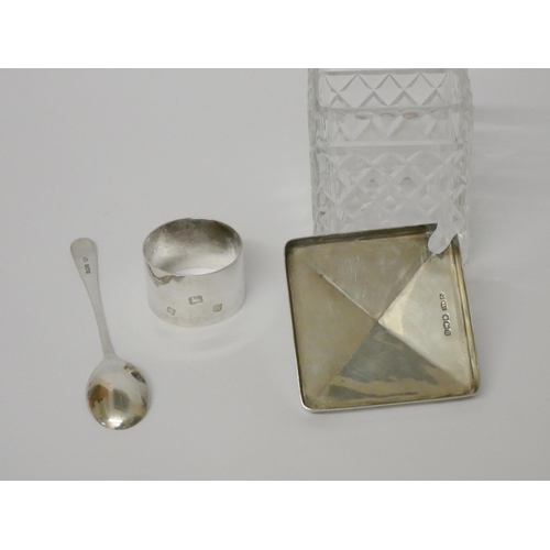 510 - A silver topped cut glass preserve jar with spoon and a silver napkin ring. Weighable silver 3.5 tro... 