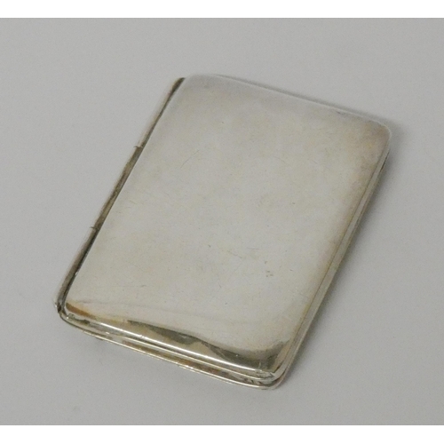 513 - A hallmarked miniature silver folding photograph frame. 5.5 cms tall