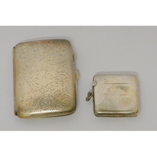 516 - A hallmarked silver Edwardian cigarette case with engraved decoration and a silver vesta, gross weig... 