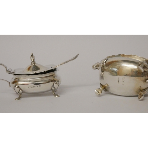 517 - Two hallmarked silver mustards, both with blue glass liners and spoons