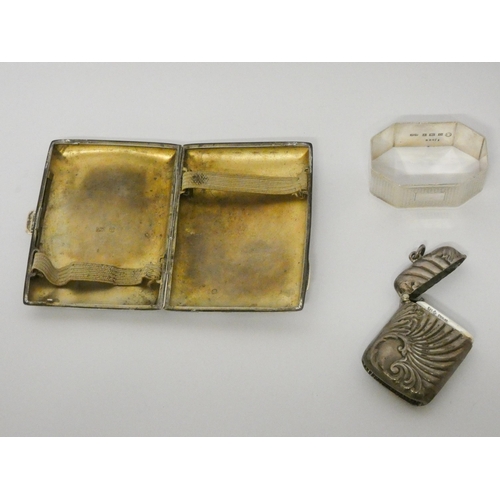 520 - Art nouveau silver vesta case and a hallmarked silver cigarette case, and a silver napkin ring. Gros... 