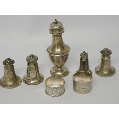 521 - A collection of small silver ware - sugar shaker, napkin rings, condiments etc.