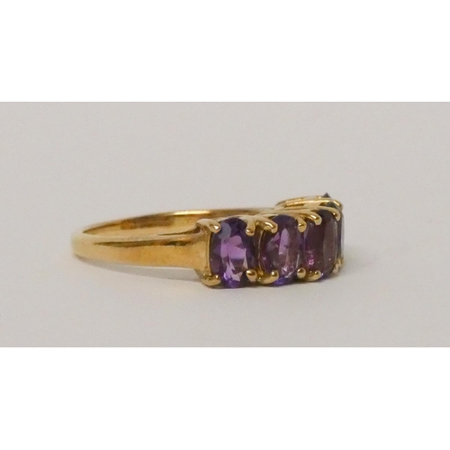 574 - 9ct yellow gold five stone amethyst half hoop ring, hallmarked, ring size N