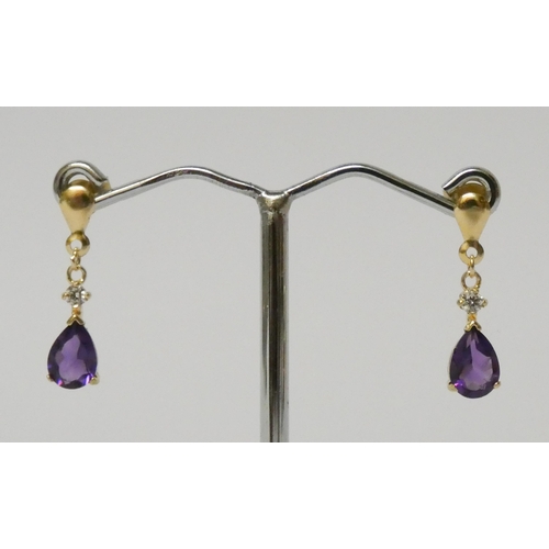 579 - Pair of 9ct gold amethyst drop earrings.