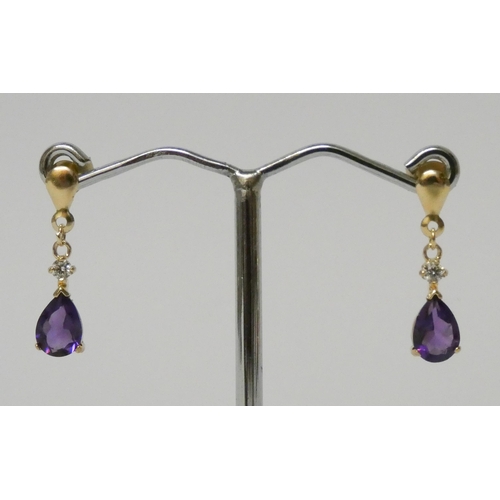 579 - Pair of 9ct gold amethyst drop earrings.