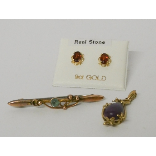 584 - A pair of garnet 9ct gold ear studs, a 9ct gold pendant and an Edwardian bar brooch marked 9ct.