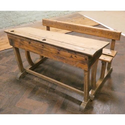 465 - A striped and waxed pine double school desk with bench style seat