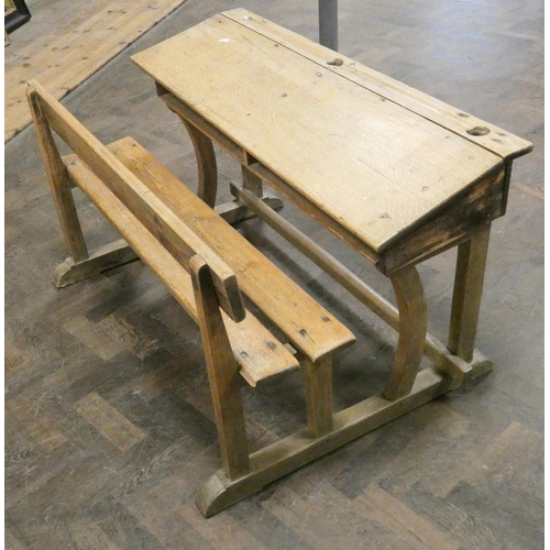 465 - A striped and waxed pine double school desk with bench style seat