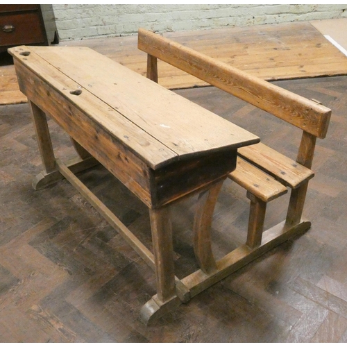 465 - A striped and waxed pine double school desk with bench style seat