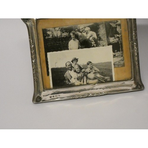 529 - A collection of four hallmarked silver rectangular photograph frames