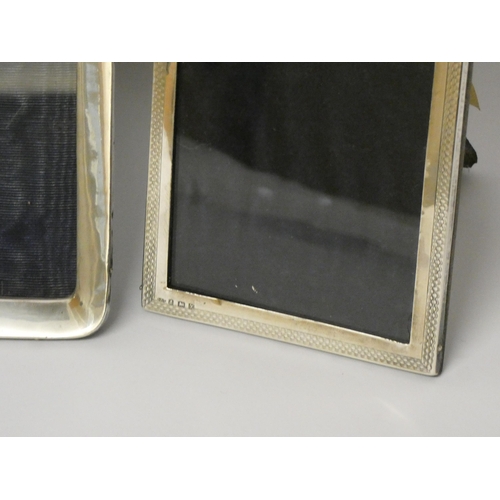 529 - A collection of four hallmarked silver rectangular photograph frames