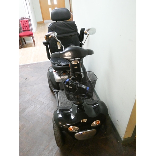 802 - A black and silver Shop Rider Deluxe, four narrow wheeled mobility scooter, with front basket, rear ... 