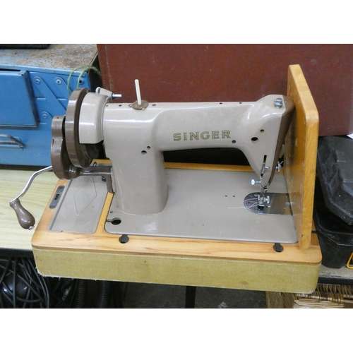 852 - A grey coloured Singer sewing machine in carrying case