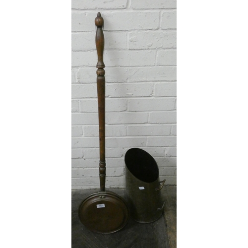 863 - A copper coal scuttle and a copper wall hanging bed warming pan