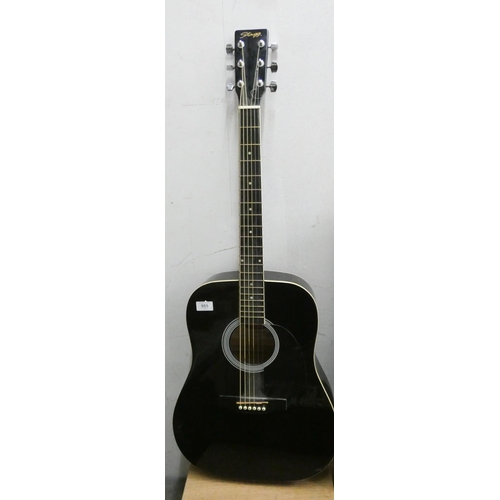 865 - A black cased Stagg guitar